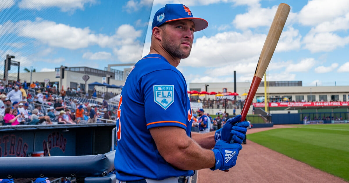 Tim Tebow of the New York Mets warms up before a spring training game against the Washington Nationals in West Palm Beach, Florida, on March 7, 2019.