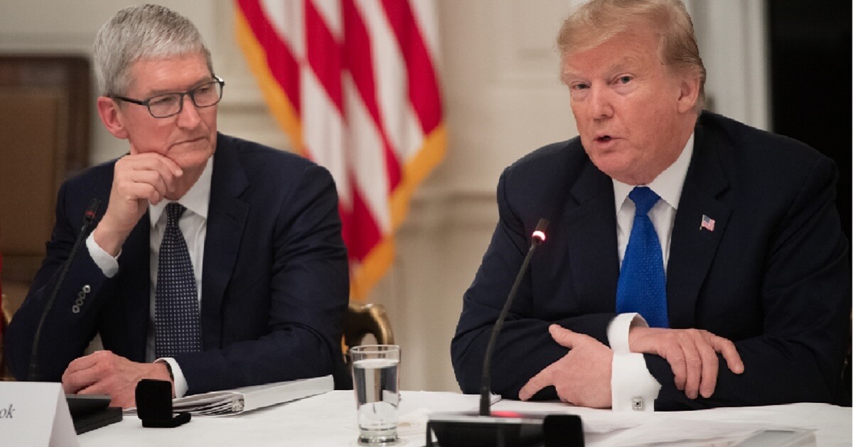 President Donald Trump is pictured Wednesday at the White House with Apple CEO Tim Cook.