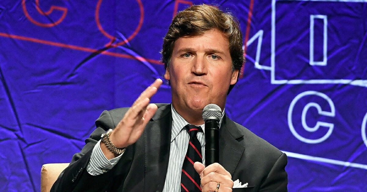 Fox News anchor Tucker Carlson addresses a Politicon audience Oct. 21, 2018, in Los Angeles.