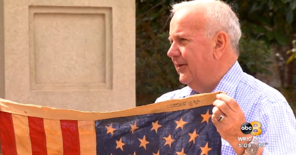 Henrico, Virginia, veteran Richard Oulton with his flag.
