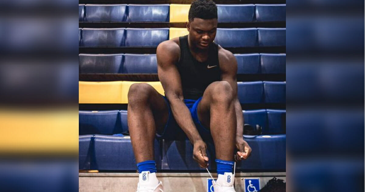 Duke star Zion Williamson laces up a pair of Nike Kyrie 4s.
