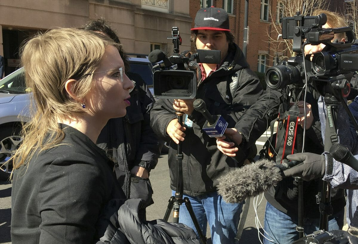 Chelsea Manning addresses the media outside federal court in Alexandria, Virginia.