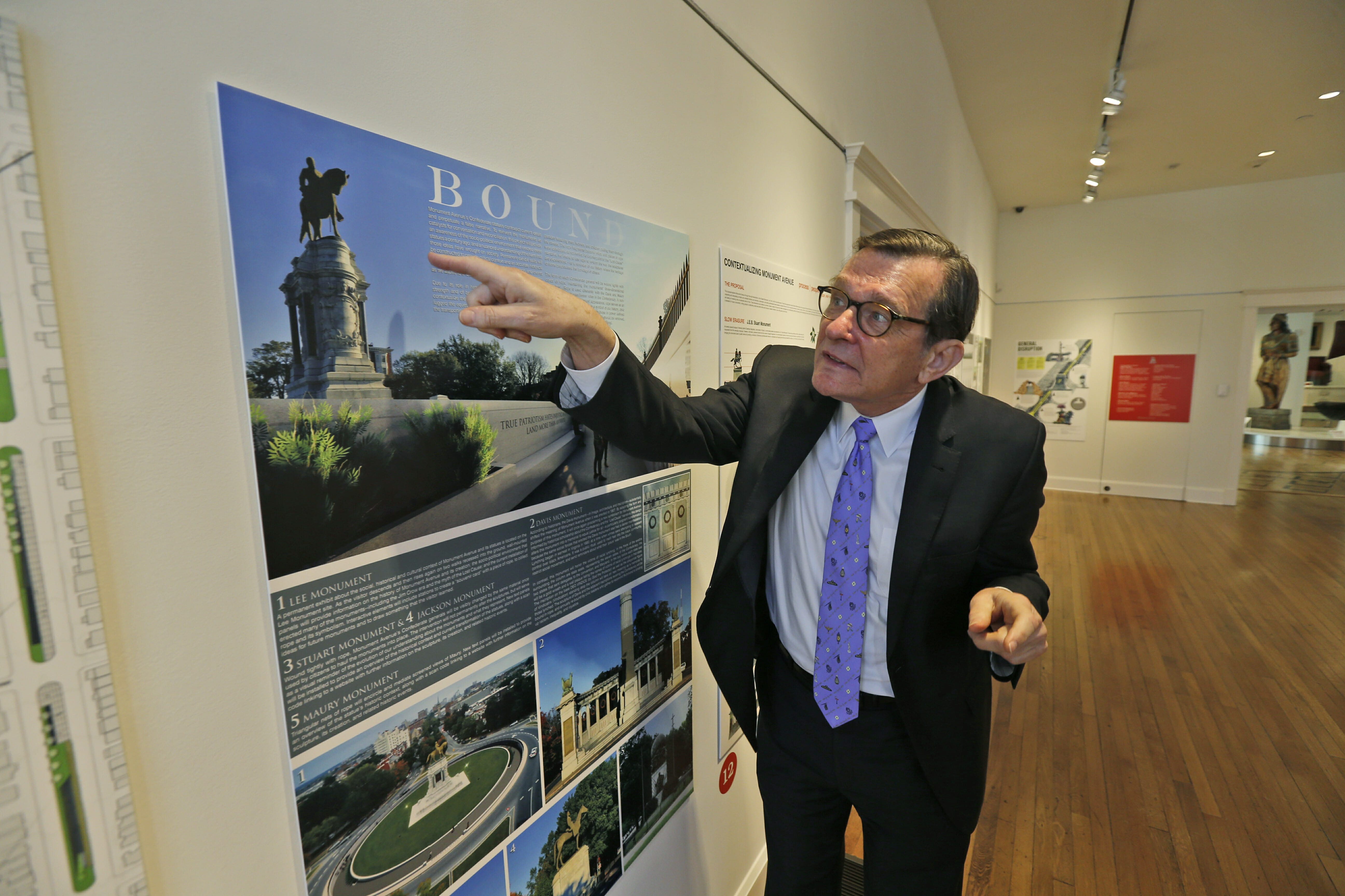 Director of the Valentine museum Bill Martin gestures as he looks over one of the proposals for changes to Confederate statues on Monument Avenue in Richmond, Virginia, Tuesday, Feb. 26, 2019.