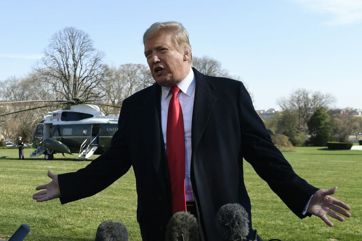 President Donald Trump talks with reporters before boarding Marine One on the South Lawn of the White House in Washington, Thursday, March 28, 2019.