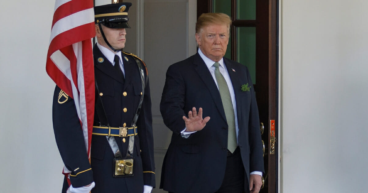 President Donald Trump waves to members of the media as Ireland Prime Minister Leo Varadkar arrives on March 14, 2019 in Washington, D.C.