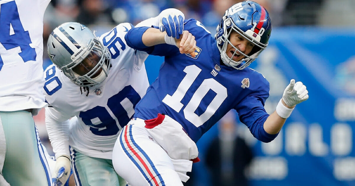 Demarcus Lawrence of the Dallas Cowboys in action against Eli Manning of the New York Giants on Dec. 30, 2018 at MetLife Stadium in East Rutherford, New Jersey.