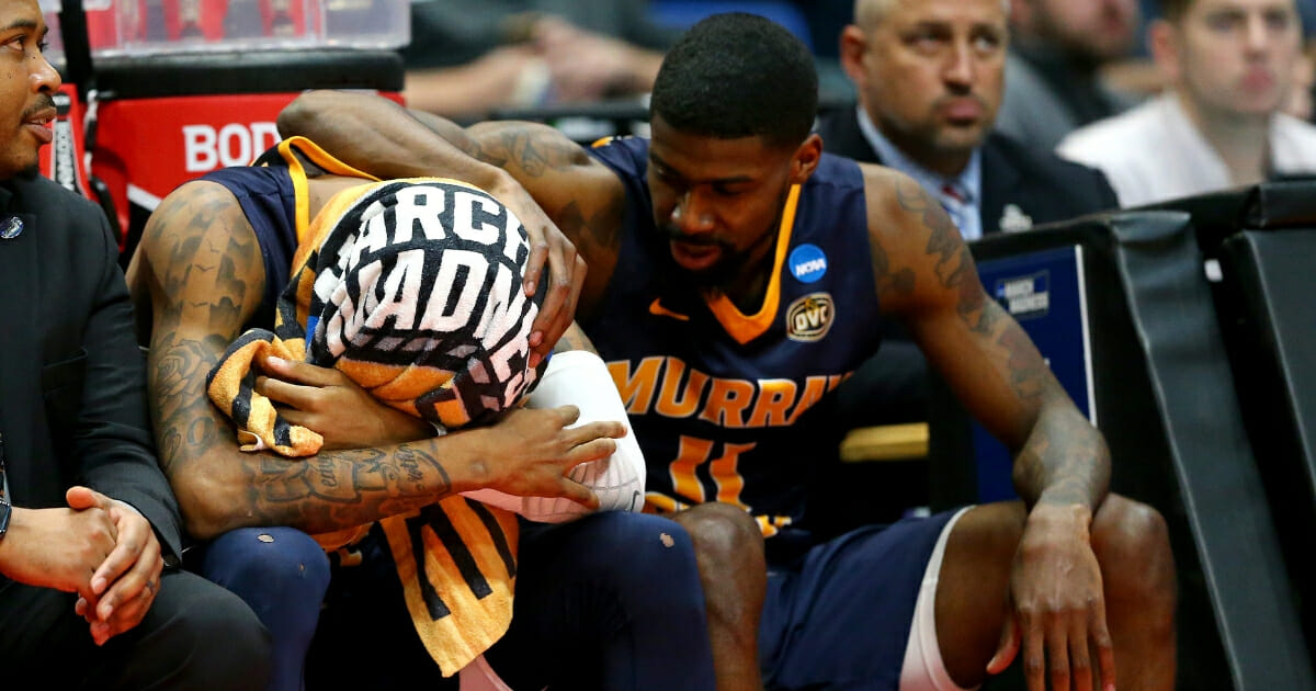 Ja Morant of the Murray State Racers is consoled by teammate Shaq Buchanan as he reacts late in the game of his team's loss to the Florida State Seminoles during the second round of the 2019 NCAA Men's Basketball Tournament at XL Center on Mar. 23, 2019 in Hartford, Connecticut.