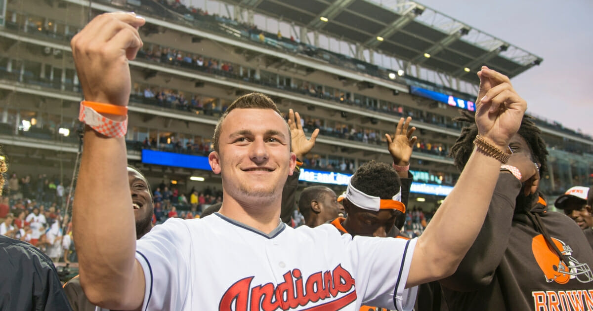 Johnny Manziel acknowledges the crowd prior to the game between the Cleveland Indians and the Boston Red Sox at Progressive Field on June 4, 2014 in Cleveland.