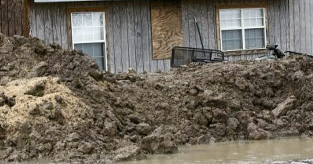 A makeshift levee was built by a resident of Rolling Fork, Mississippi, to protect his home from flood waters.