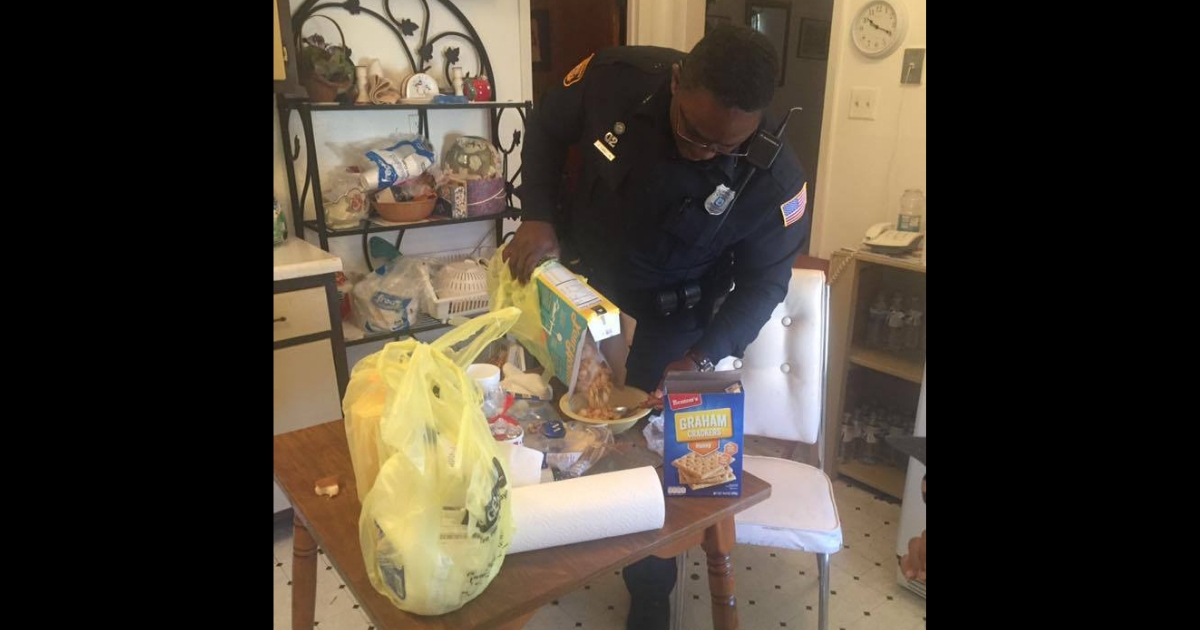 Police officer pouring cereal for a mentally ill person.