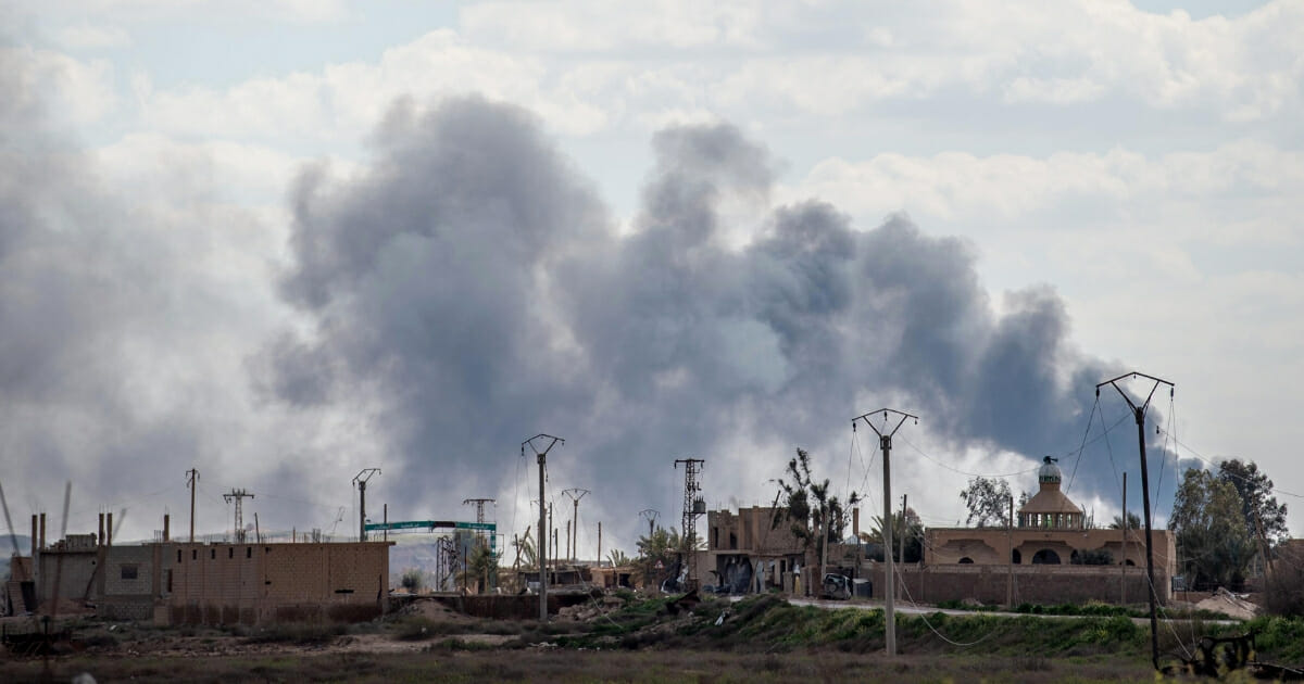 Smoke billows after shelling on the Islamic State group's last holdout of Baghouz, in the eastern Syrian Deir Ezzor province on March 2, 2019.