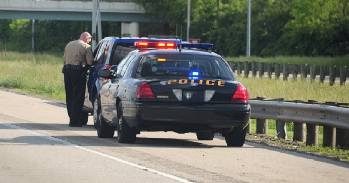 A police officer conducting a traffic stop.