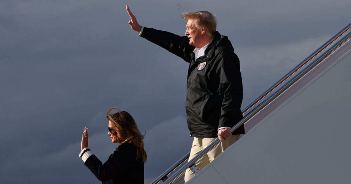 President Donald Trump and first lady Melania Trump arrive at Palm Beach International Airport in Florida on March 8, 2019 after touring areas in neighboring Alabama affected by recent tornadoes.