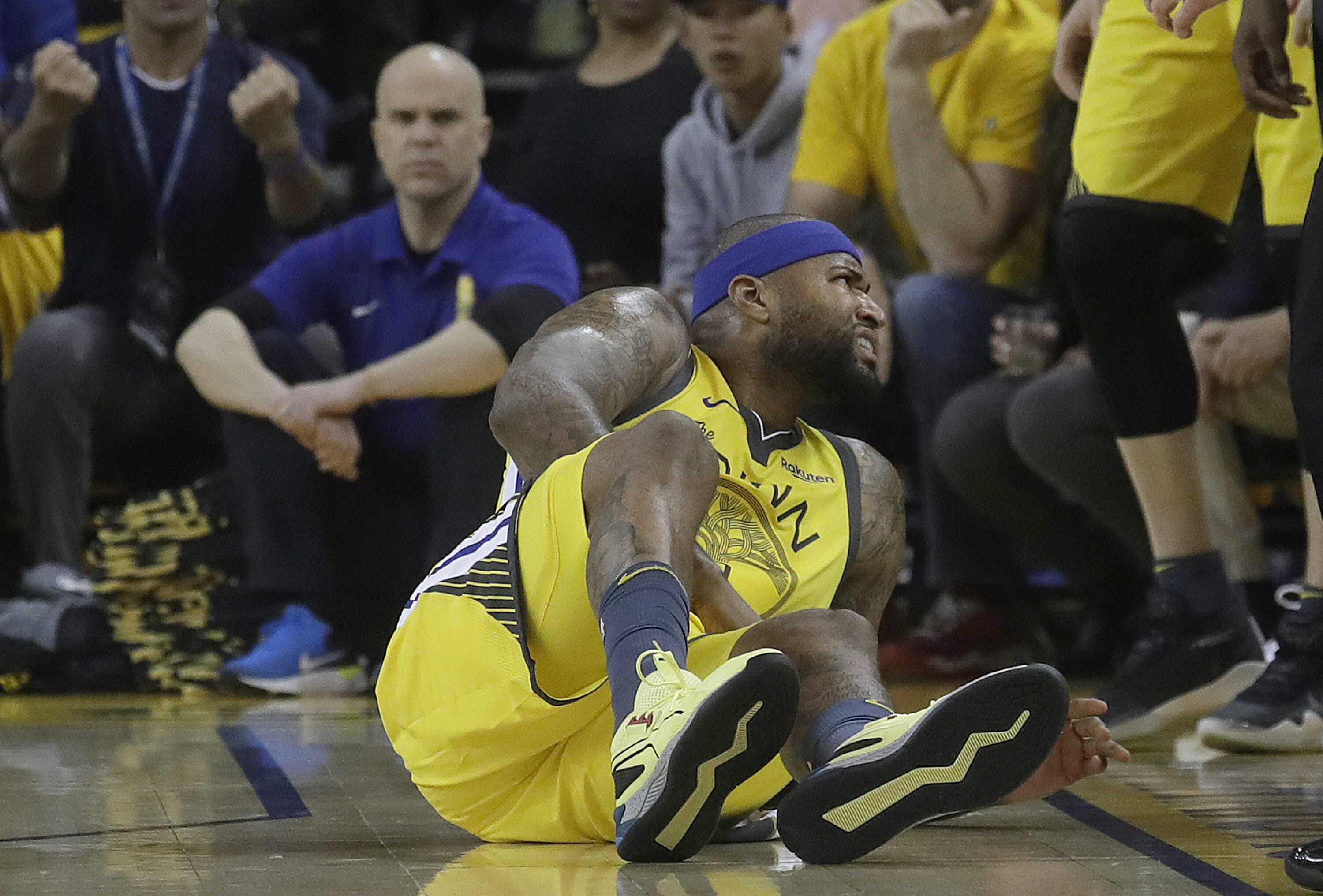 Golden State Warriors center DeMarcus Cousins reacts after falling to the floor during the first half of Game 2 of a first-round NBA basketball playoff series against the Los Angeles Clippers in Oakland, California, Monday, April 15, 2019.