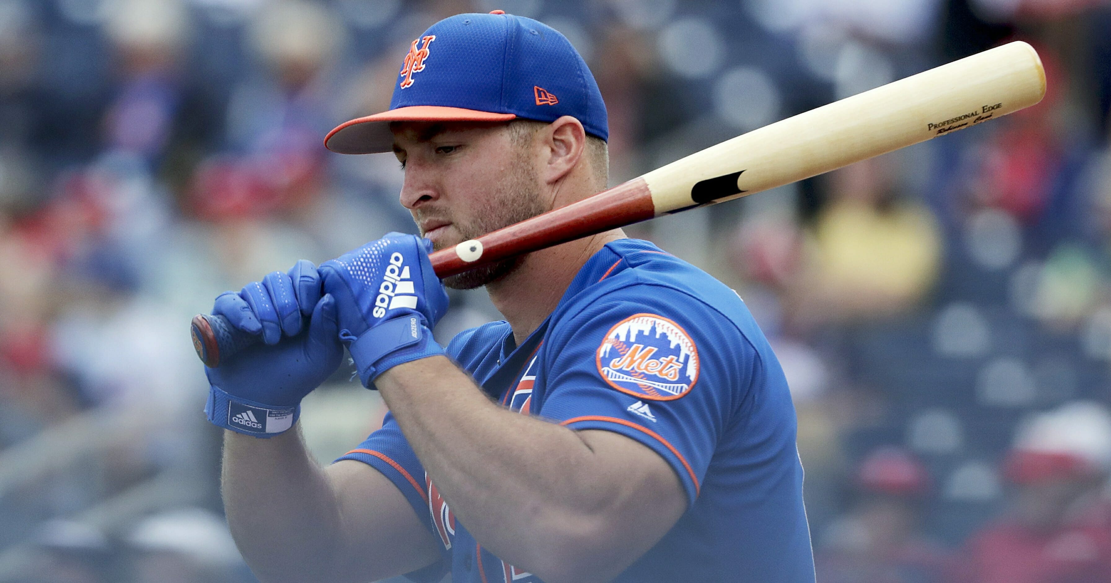 In this March 7, 2019, file photo, New York Mets' Tim Tebow loosens up before batting in an exhibition spring training baseball game against the Washington Nationals in West Palm Beach, Fla.