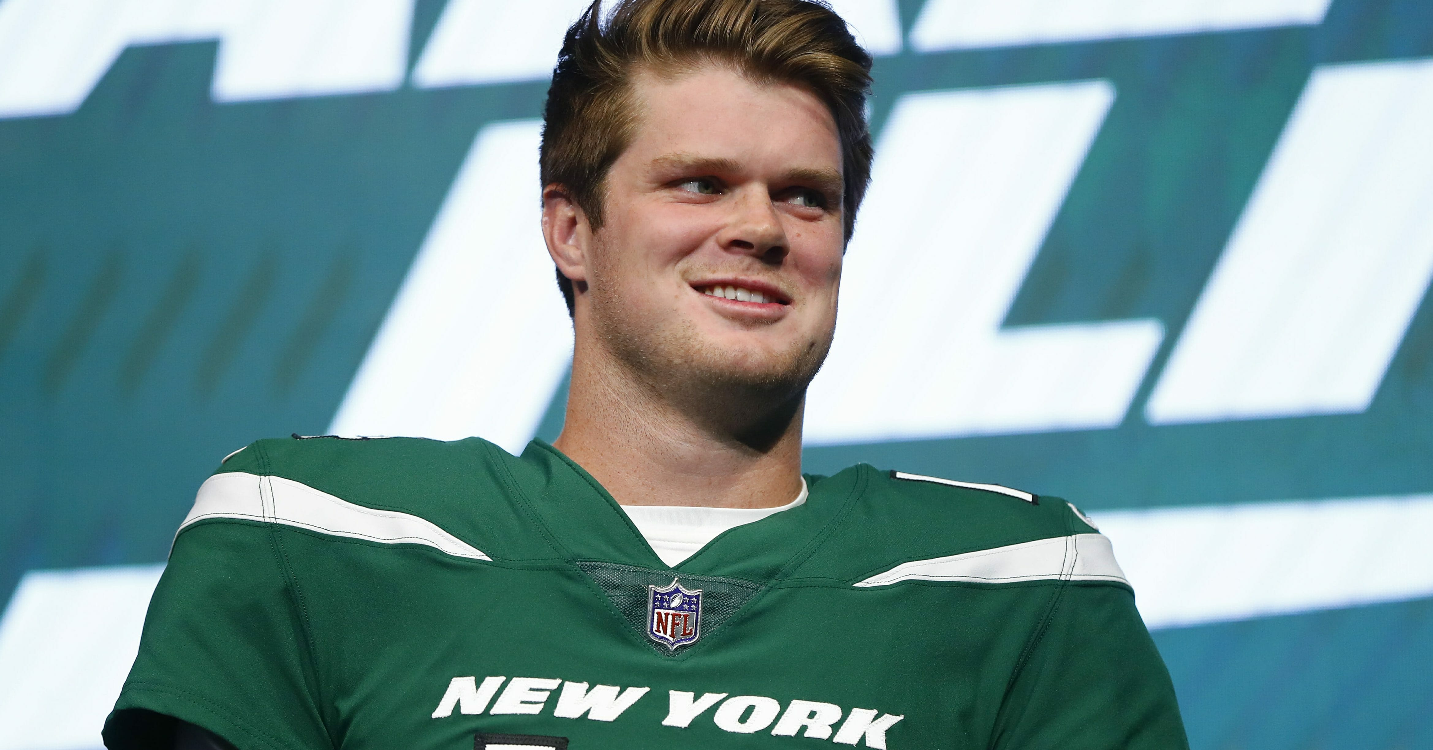 New York Jets quarterback Sam Darnold models the team's new "Gotham green" uniform April 4, 2019, in New York.