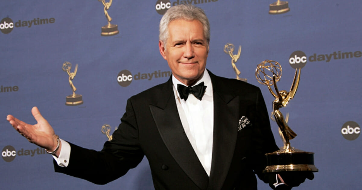 In this Friday, April 28, 2006, file photo, Alex Trebek holds the award for outstanding game show host, for his work on "Jeopardy!" backstage at the 33rd Annual Daytime Emmy Awards in Los Angeles.