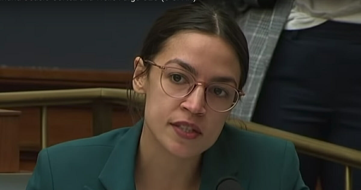 Rep. Alexandria Ocasio-Cortez questions Wells Fargo CEO Timothy Sloan during a House Financial Services Committee hearing.