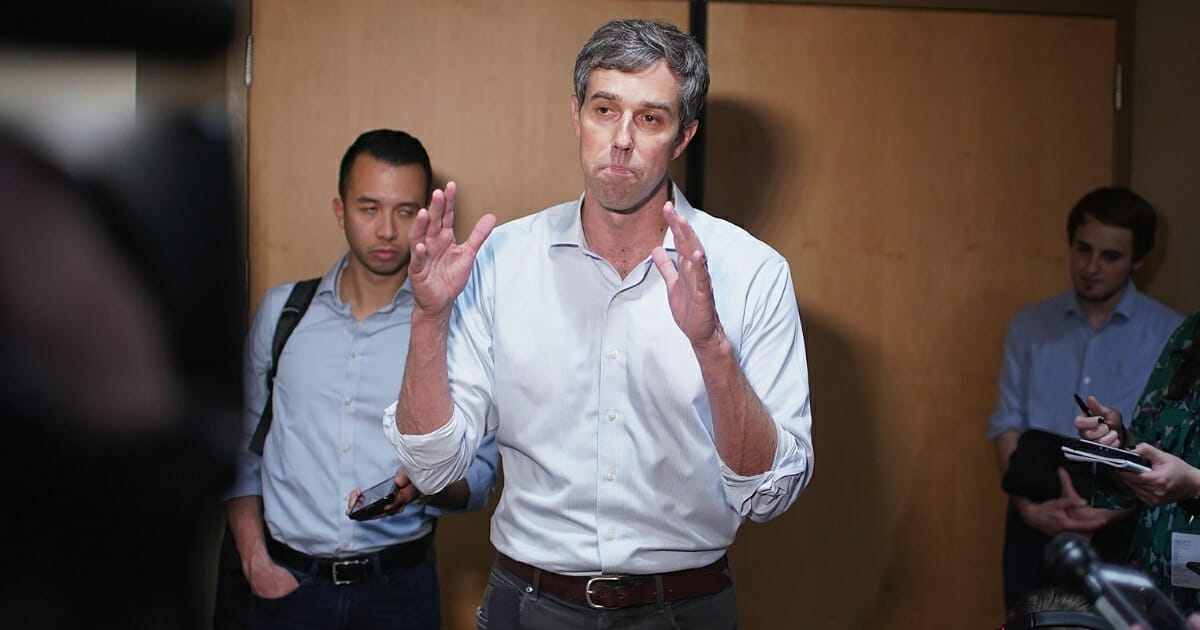 Beto O'Rourke speaks to reporters following a campaign rally on the campus of the University of Iowa on April 7, 2019, in Iowa City.