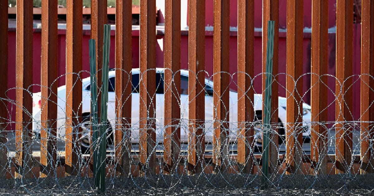 A barrier with concertina wire at its base is pictured at the U.S.-Mexico border in Calexico, California, in January.