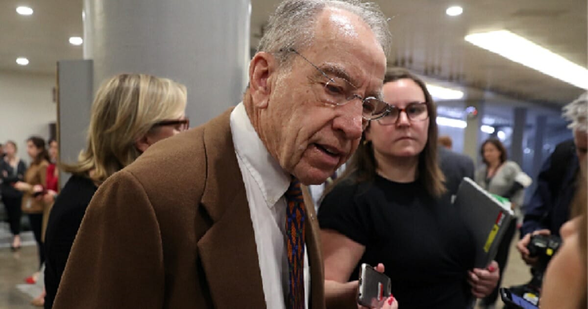 Iowa Sen. Chuck Grassley is interviewed by the media after the Senate's March 15 vote against President Donald Trump's national emergency declaration.