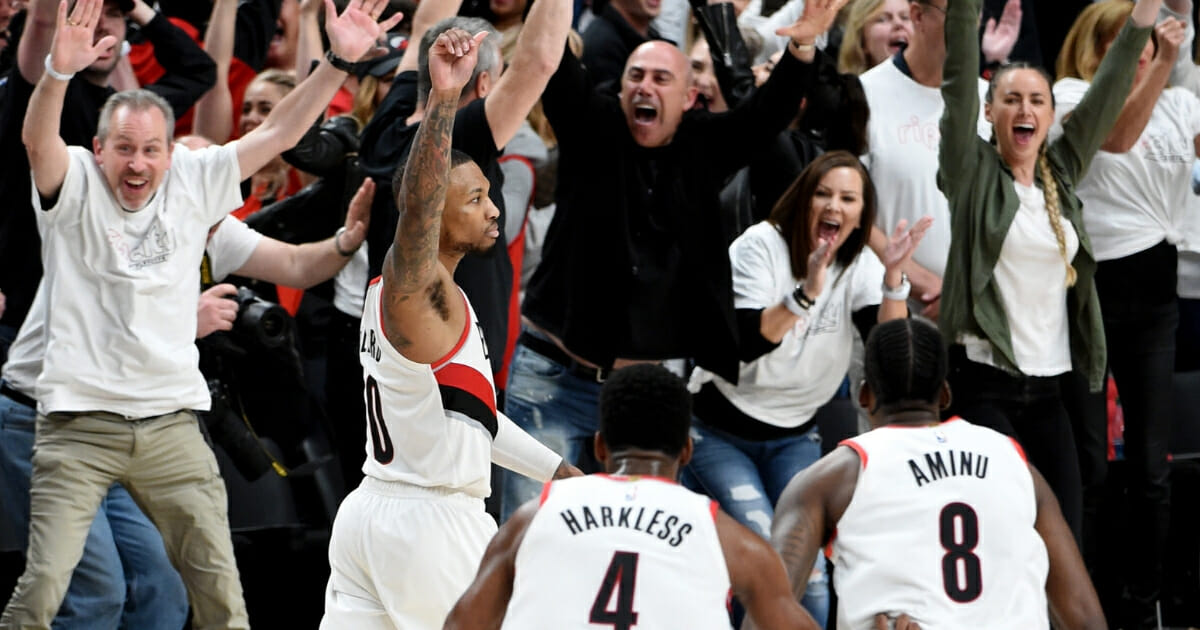 Damian Lillard of the Portland Trail Blazers reacts after hitting the game-winning shot in Game 5 of the Western Conference quarterfinals against the Oklahoma City Thunder on April 23, 2019, at Moda Center.