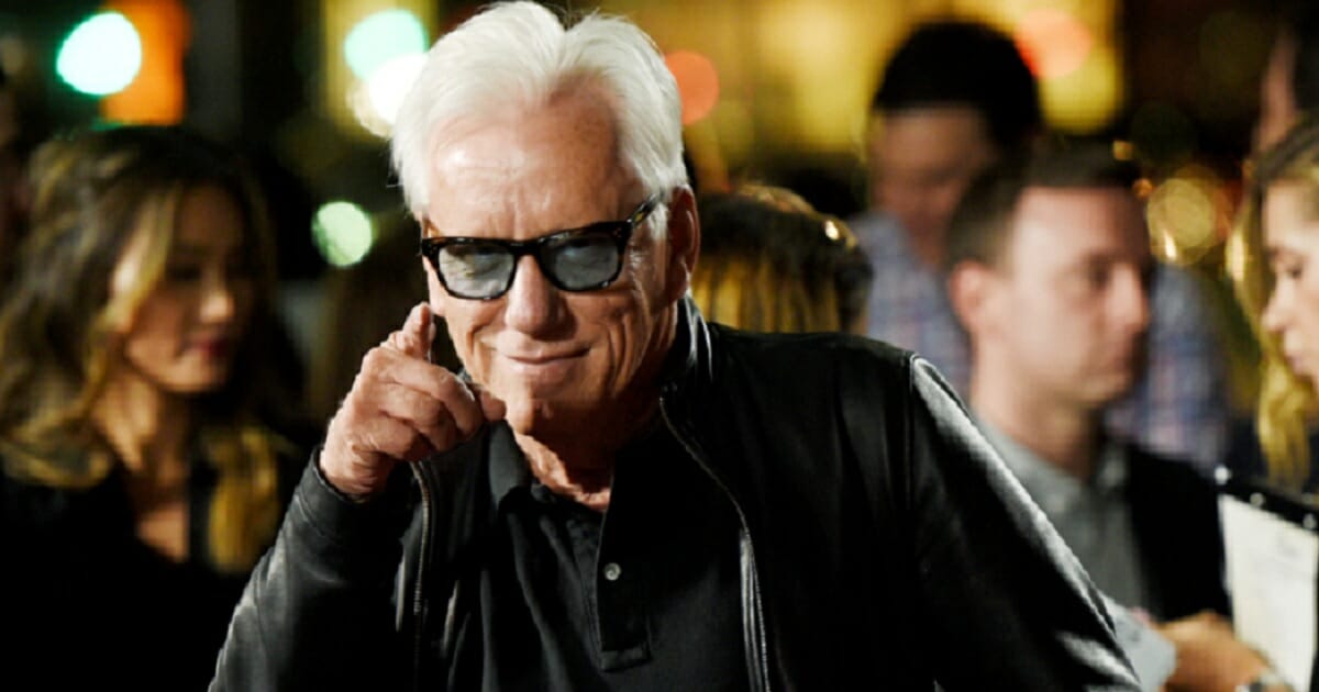 James Woods points at the camera in a file photo from 2016.