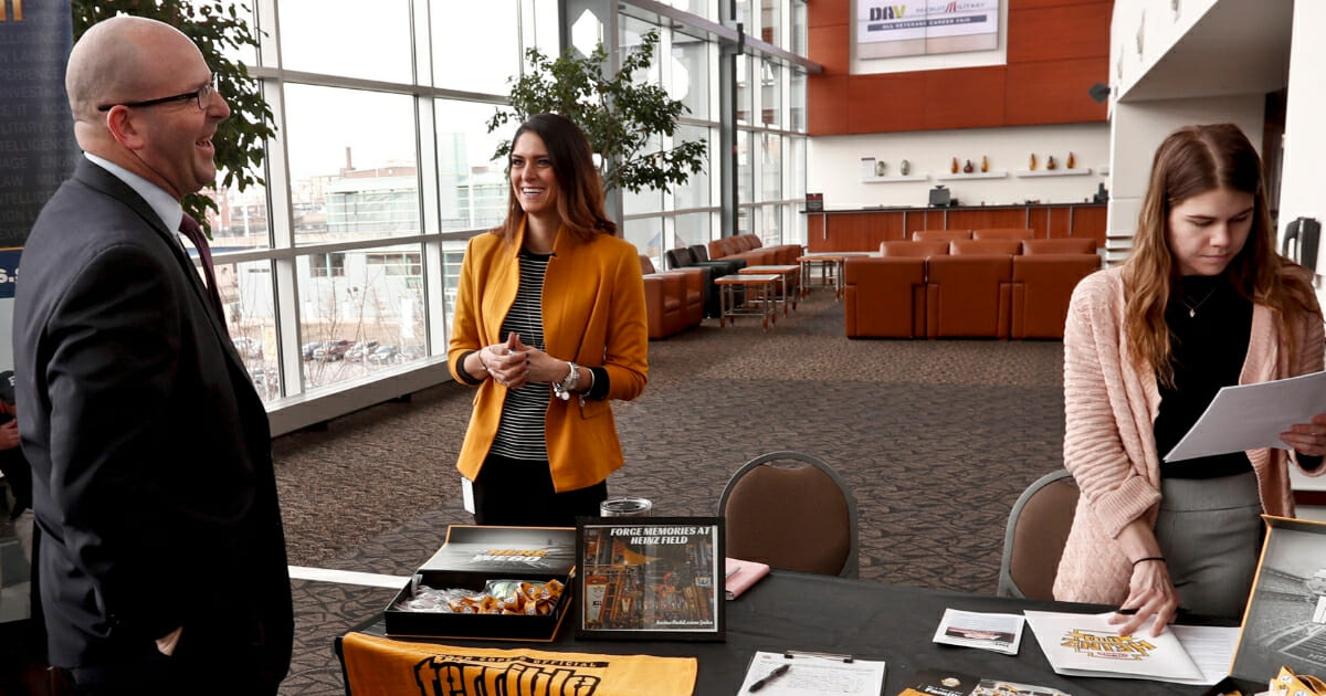 Visitors to the Pittsburgh veterans job fair meet with recruiters at Heinz Field on March 7, 2019.