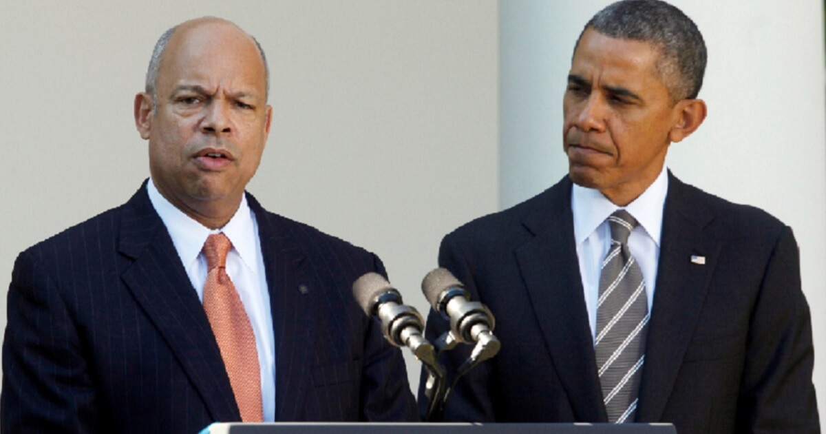 Former Department of Homeland Security Secretary Jeh Johnson, left, is introduced by President Barack Obama in the White House Rose Garden in October 2013.