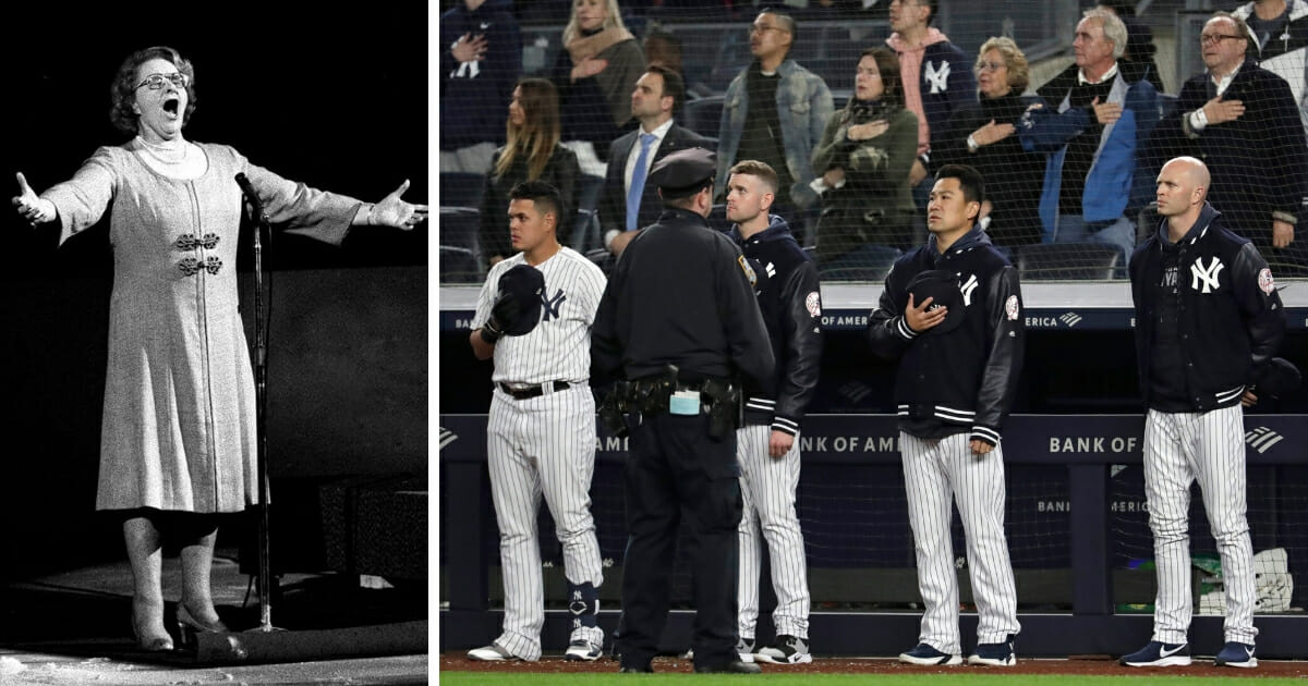 New York Yankees players, right, listen to "God Bless America." At left is singer Kate Smith.