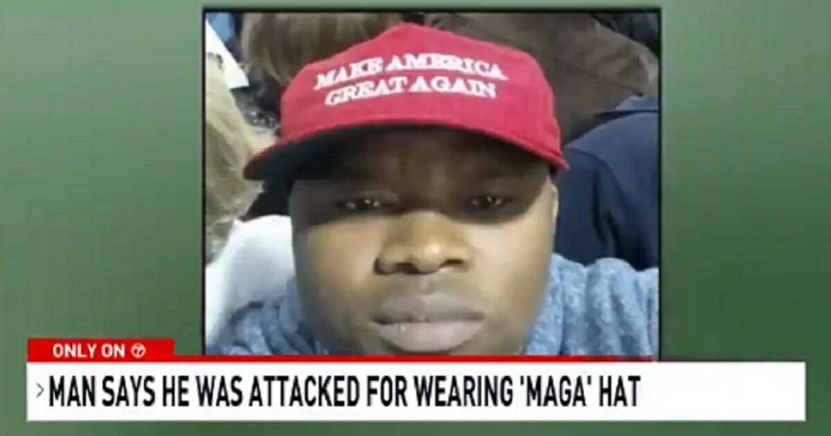 Atsu Mable wearing a "Make America Great Again" hat.