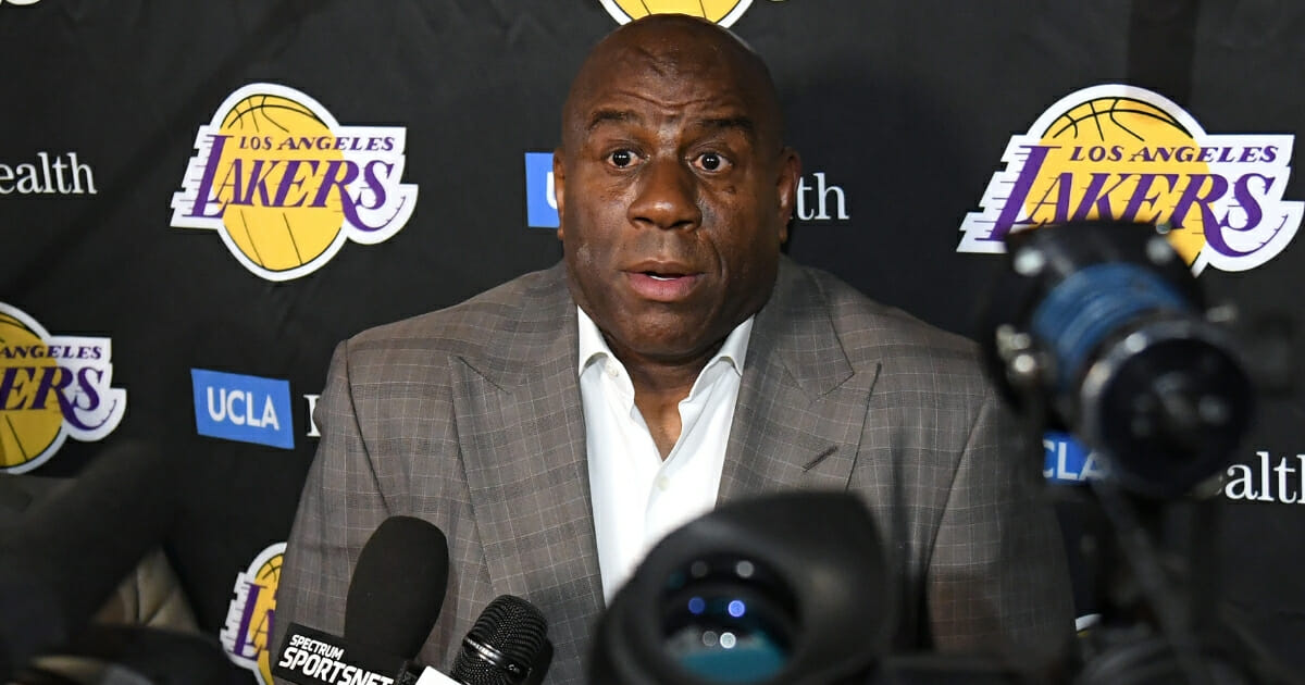 Magic Johnson reacts as he speaks to reporters April 9, 2019, in Los Angeles.