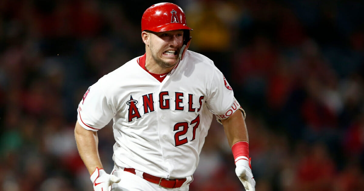 Mike Trout of the Los Angeles Angels of Anaheim runs to first base after hitting a single in the second inning against the Milwaukee Brewers on April 9, 2019.