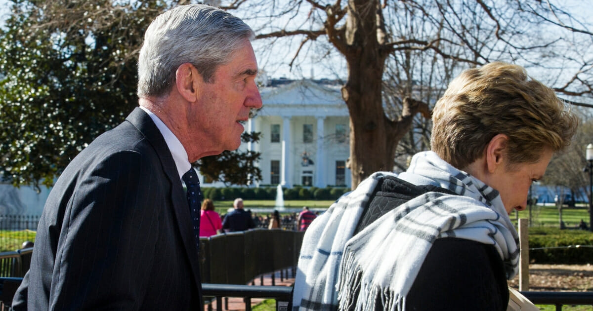 Robert Mueller and his wife, Ann, walk past the White House on March 24, 2019, in Washington, D.C.