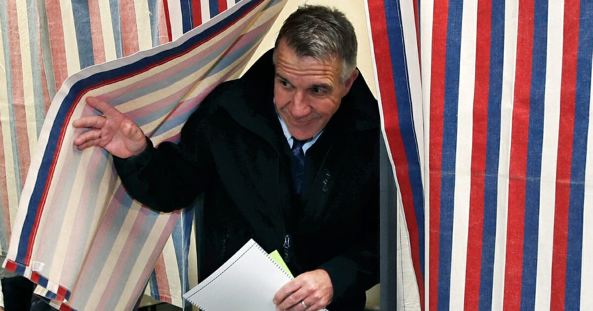 Republican Vermont Gov. Phil Scott leaves the ballot booth in Berlin, Vt., on Nov. 6, 2018.