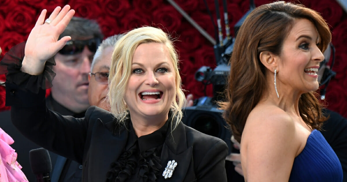 Actresses Amy Poehler, left, and Tina Fey arrive for the 91st Annual Academy Awards in Hollywood, on February 24, 2019.