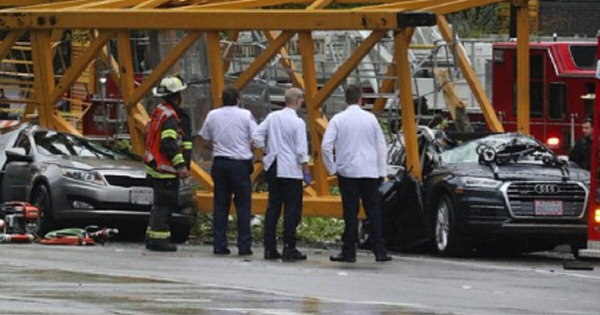 Emergency officials on the scene of a construction crane collapse in Seattle that killed four people on Saturday.