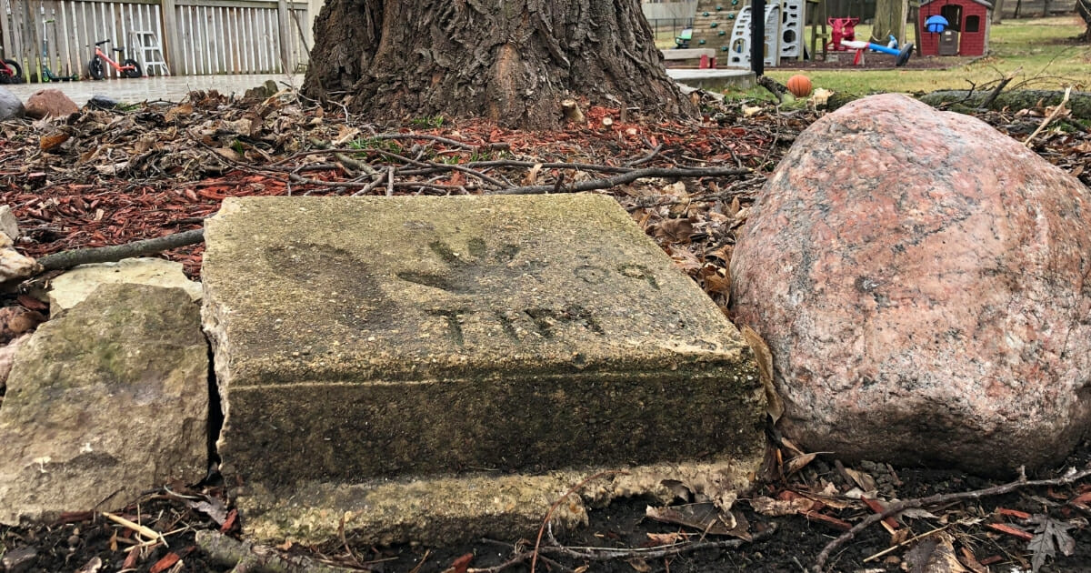 A slab of concrete in the backyard of the house where Timmothy Pitzen used to live in Aurora, Ill., on Thursday, April 4, 2019.
