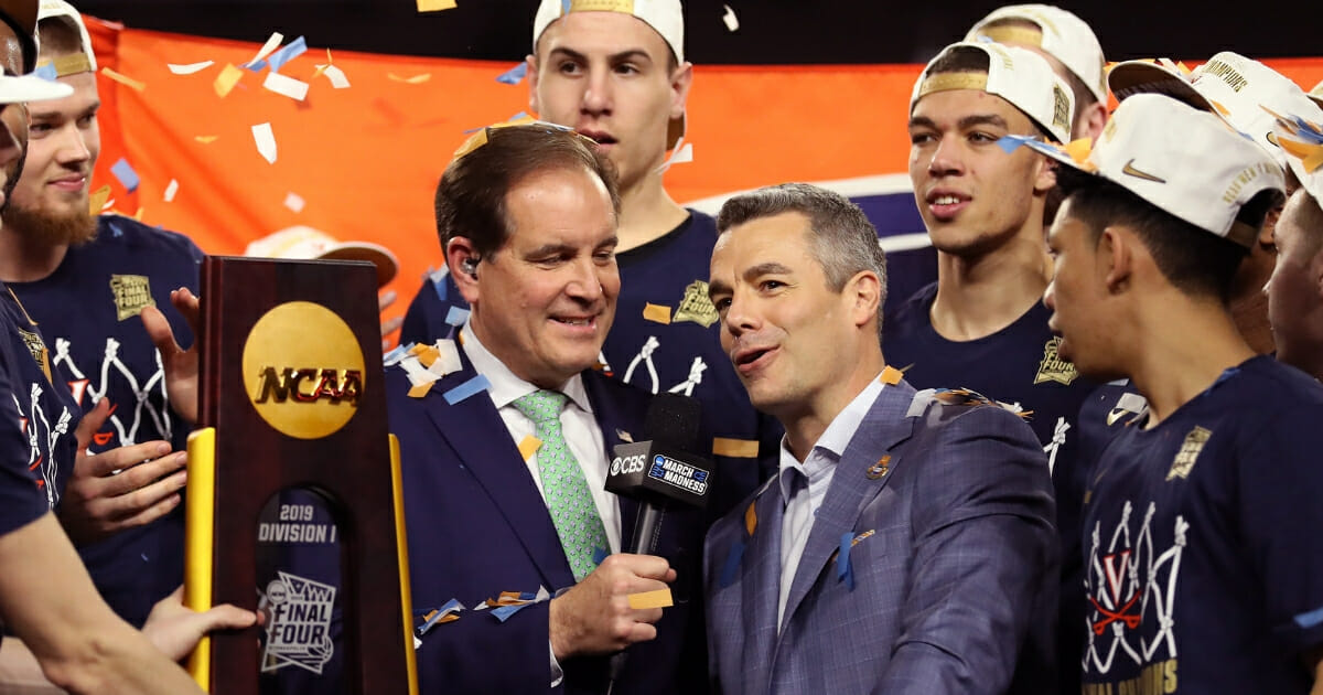 Head coach Tony Bennett, right, of the Virginia Cavaliers is interviewed by Jim Nantz after his team's 85-77 win over the Texas Tech Red Raiders on April 8, 2019, in Minneapolis.