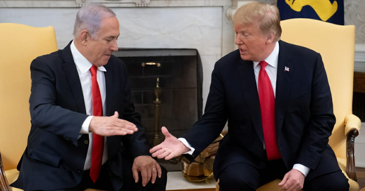 Israeli Prime Minister Benjamin Netanyahu, left, and President Donald Trump prepare to share a handshake in the Oval Office during Netanyahu's visit to Washington in March.