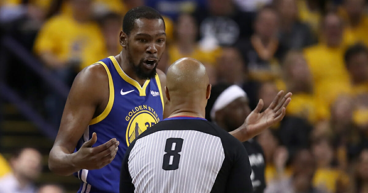 Kevin Durant of the Golden State Warriors questions a call by referee Marc Davis on Wednesday during Game 5 of the NBA Western Conference Playoffs at Oracle Arena in Oakland.