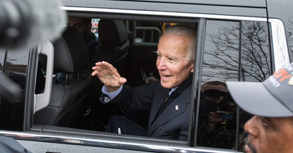 Former Vice President Joe Biden leaves a union rally in Massachusetts on April 18.