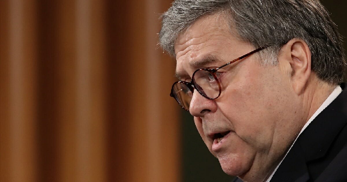 Attorney General William Barr addresses reporters at a news conference Thursday.