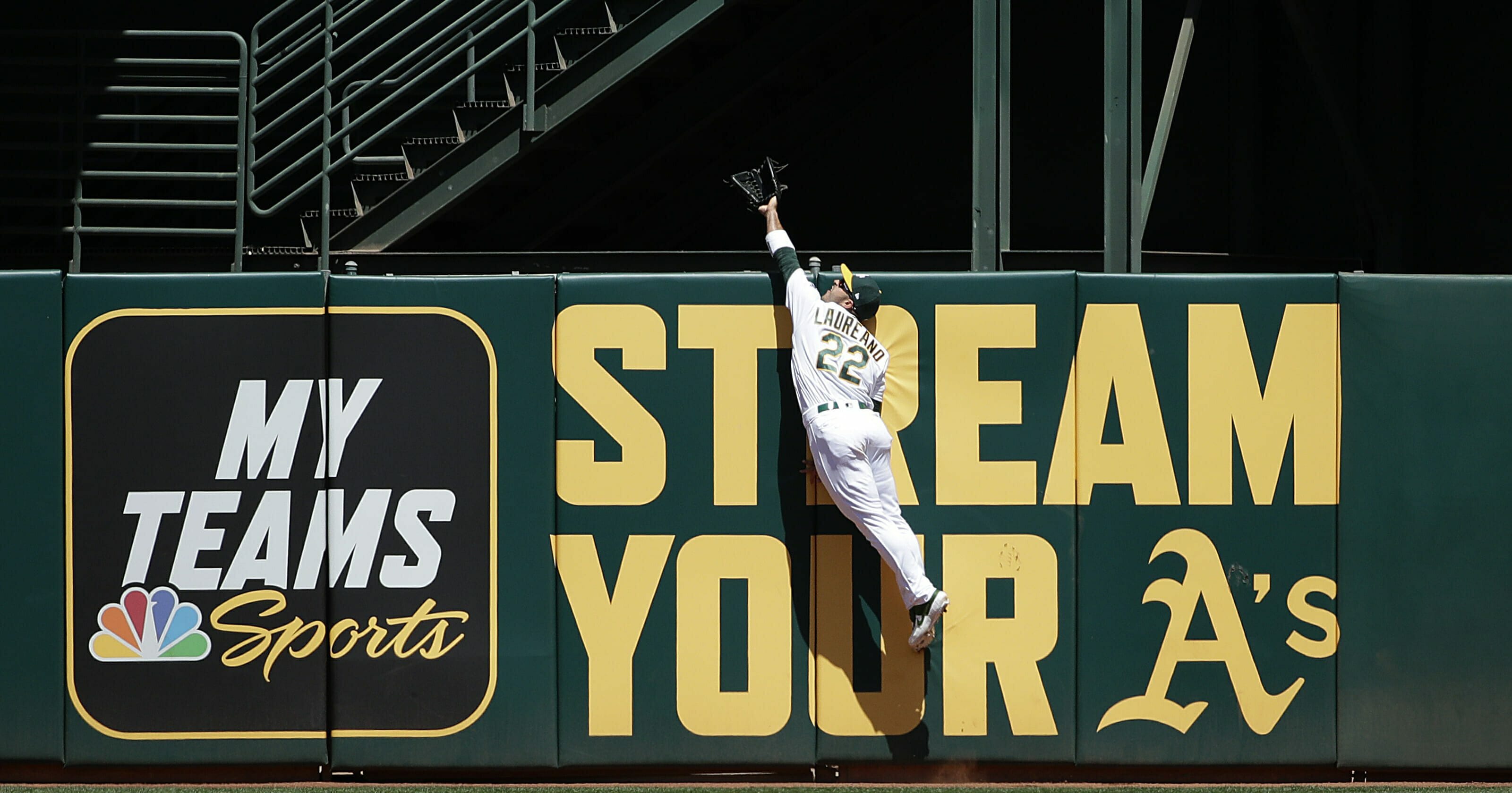 Oakland Athletics center fielder Ramon Laureano jumps to catch a fly ball hit by Toronto Blue Jays' Teoscar Hernandez during the second inning of a baseball game in Oakland, Calif., Sunday, April 21, 2019.