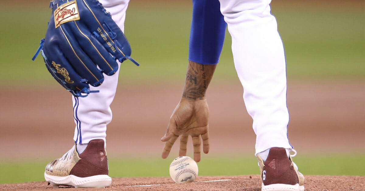 Marcus Stroman of the Toronto Blue Jays picks up the baseball on the rubber as he takes the mound and gets ready to pitch in the first inning during MLB game action against the Tampa Bay Rays at Rogers Centre on April 14, 2019 in Toronto.