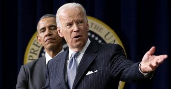 President Barack Obama (left) listens to Vice President Joe Biden deliver remarks.