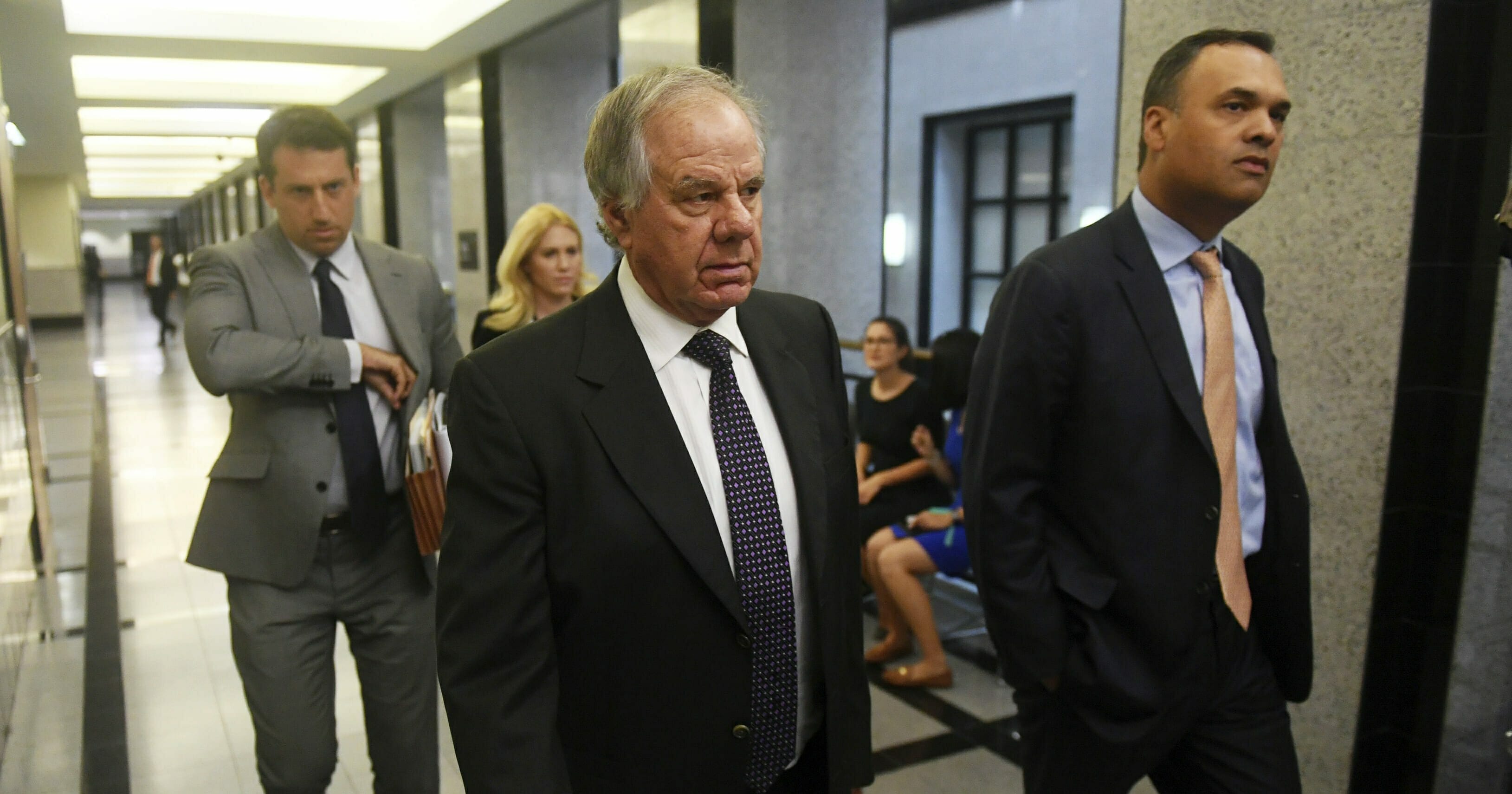 Attorneys Jack Goldberger, center, Alex Spiro, left, and William Burck, the defense team for New England Patriots owner Robert Kraft, make their way to Courtroom 2E at the Palm Beach County Courthouse, Friday, April 12, 2019.