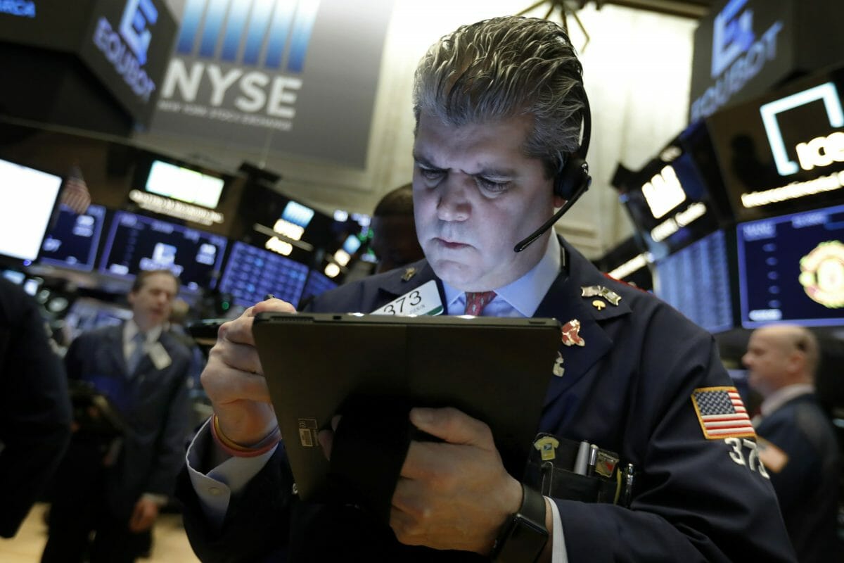 Photo trader John Panin works on the floor of the New York Stock Exchange.