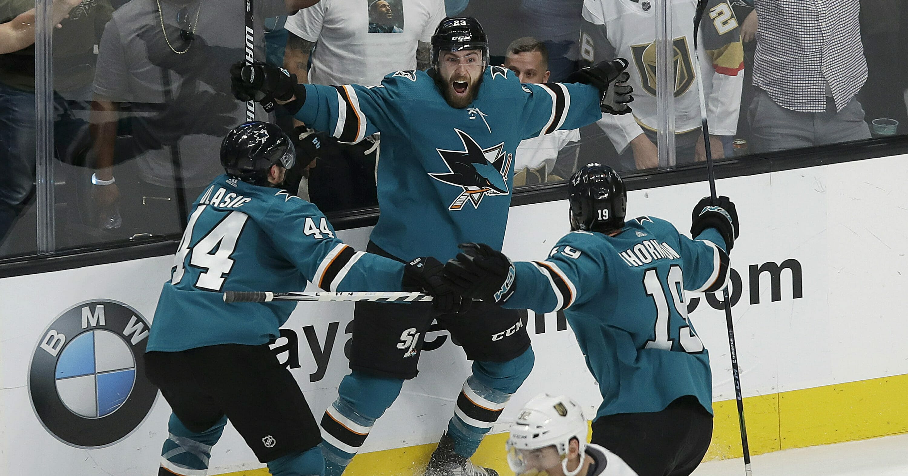 San Jose Sharks right wing Barclay Goodrow, center, celebrates with defenseman Marc-Edouard Vlasic (44) and center Joe Thornton (19) after scoring the winning goal against the Vegas Golden Knights during overtime of Game 7 of their playoff series April 23, 2019.