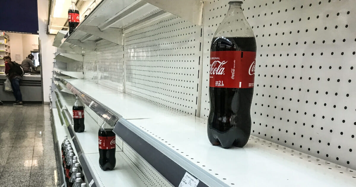 Empty shelves in supermarket because of price controls.